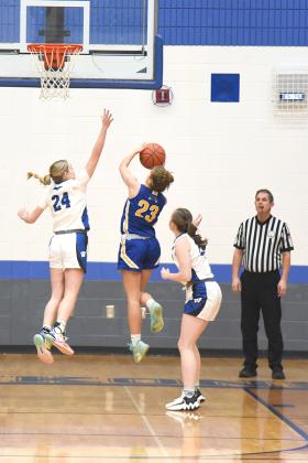 WIC Senior, Danica Shamion #24 reaching to block Flivvers Offensive player #23 Anna Bortolini’s shot at the basket. Photo by Kevin Zini