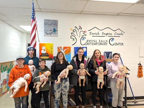 Tom Bucek (Crystal Falls Fire Dept. Training Officer) recently completed instruction in CPR/Babysitting certification for the following students; Jerome Galica, Fynnly Ketola, Rebekah Hoffman, Marleigh Ketola, Kylie Galica, William Hoffman and Jaxon Skolasinski. The Iron Area Health Foundation is very pleased to again support the training sessions with needed equipment and supplies. (Submitted photo)