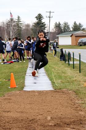 Forest Park Sophomore, Lily Sarder stretching for the Triple Jump.