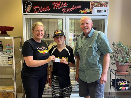 Nick Perlongo was presented with a $100 Visa Card by Susan Fritz (Owner of Dina Mia Kitchens) and Garth Soderberg (Iron County Little League President). (submitted photo)